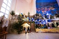 Back of three children looking in Christmas nativity crib scene in church