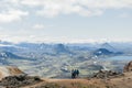 Back of three hikers admiring view of amazing landscape in Iceland while trekking famous Laugavegur trail