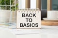 BACK TO BASICS text written on a notebook on table Royalty Free Stock Photo