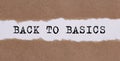 Back To Basics word written behind torn paper. business