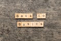 back to basics word written on wood block. back to basics text on table, concept Royalty Free Stock Photo