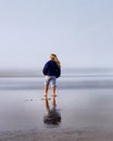 Child on Foggy Beach Alone Royalty Free Stock Photo