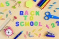 Back to the center of the light background is the inscription Back to School. Around the school and office supplies are Royalty Free Stock Photo