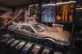 Back to the Future Delorean Car and Memorabilia Display in Nostalgic Exhibition Setting