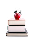 Back to School: Apple Alarm Clock on Stack of Books