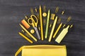 Back to school autumn concept. Top above overhead view photo of set falling yellow stationery and pencil box isolated on Royalty Free Stock Photo