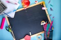 Back to school background with accessories for the schoolroom - pencils, notebooks, books, scissors, chalk, markers, blue Royalty Free Stock Photo