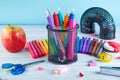 Back to school background with accessories for the schoolroom white-blue background, above copy space Royalty Free Stock Photo