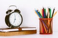 Back to school background with books and alarm clock Royalty Free Stock Photo