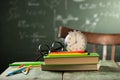 Back to school background with books and alarm clock Royalty Free Stock Photo