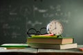 Back to school background with books and alarm clock Royalty Free Stock Photo