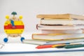 Back to school background with books and alarm clock over chalkboard Royalty Free Stock Photo