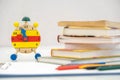 Back to school background with books and alarm clock over chalkboard Royalty Free Stock Photo