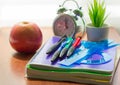 Back to school background with books and apple over blackboard Royalty Free Stock Photo