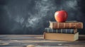 Back to School Background with Books and Apple Over Blackboard Royalty Free Stock Photo
