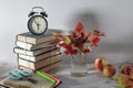 Back to school background with books and apple over blackboard Royalty Free Stock Photo