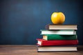 Back to school background with books and apple over blackboard. Stack of school books on the table. AI Generated Royalty Free Stock Photo