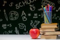 Back to school background with books, pencils and apple on white table Royalty Free Stock Photo