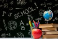 Back to school background with books, pencils and apple on white table Royalty Free Stock Photo