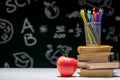 Back to school background with books, pencils and apple on white table Royalty Free Stock Photo