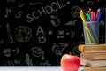 Back to school background with books  pencils and apple on white table Royalty Free Stock Photo