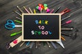 Back to school background concept. Back to Scool wood text arrange on blackboard on wood background with School supplies, station Royalty Free Stock Photo