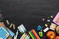 Back to School background concept. School supplies on a chalkboard background. Education background concept with copyspace. View