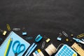 Back to School background concept. School supplies on a chalkboard background. Education background concept with copyspace. View