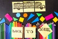 Back to school background with a lot of colorful felt-tip pens and colorful pencils, titles `Back to school` Royalty Free Stock Photo