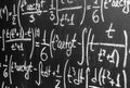 Back to school background with math formulas are written by white chalk on the black chalkboard. Royalty Free Stock Photo