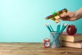 Back to school background with pencils, airplane toy and books on wooden table Royalty Free Stock Photo