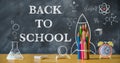 Back to school background with rocket made from pencils on blackboard. Royalty Free Stock Photo