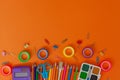 Back to school background with school supplies on orange table. Top view from above Royalty Free Stock Photo