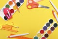 Back to school background, school background. School supplies on a yellow background with space for text. Watercolor, scissors,