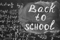 Back to school background with title `Back to school` and math formulas are written by white chalk on the black chalkboard. Royalty Free Stock Photo