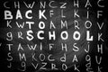 Back to school background with title `Back to school` among other letters of English alphabet Royalty Free Stock Photo