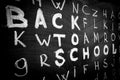 Back to school background with title `Back to school` among other letters of English alphabet Royalty Free Stock Photo