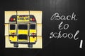 Back to school background with title `Back to school` and `school bus` written on the yellow pieces of paper