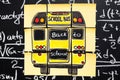 Back to school background with title `Back to school` and `school bus` written on the yellow pieces of paper on the chalkboard Royalty Free Stock Photo