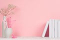 Back to school backgrounds for girl - white and pink stationery, books on white wood table and pink wall.