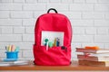 Back to school, backpack with school supplies and stationery, textbooks and notebooks on table. Royalty Free Stock Photo