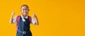 Appy asian school girl in uniform with show thumbs up for good