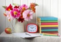 Back to school. bouquet of dahlias and textbooks Royalty Free Stock Photo