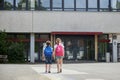 Back to school. A boy and a girl go to school, gymnasium at the beginning of the lesson. End of vacation, start of the school year