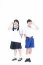 Back to School. Boy and girl wearing high school uniforms of Thailand. Children on isolated white background