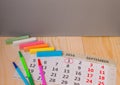Back to school, calendar, colored chalk on wooden background