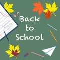 Back to school - chalk inscription and pencils, eraser, notebook, autumn leaves, paper airplane  top view. Royalty Free Stock Photo