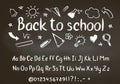Back to school chalk text on blackboard with school doodle elements and chalk alphabet Royalty Free Stock Photo