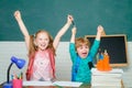 Back to school. Child from elementary school with book and bag. Kids gets ready for school. Friendly child in classroom