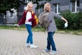 Back to school. children playing on street. Kids wearing mask and backpacks protect and safety coronavirus. Boy and girl Royalty Free Stock Photo